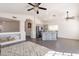 Bright living area showcasing vaulted ceilings, neutral paint, tile floors, and an island with bar stool seating at 3043 W Melinda Ln, Phoenix, AZ 85027