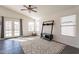 Bright living area boasting natural light, access to the backyard, tile floors, and decorative ceiling fan at 3043 W Melinda Ln, Phoenix, AZ 85027