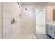 This walk-in shower features white marbled subway tile and a glass enclosure at 3043 W Melinda Ln, Phoenix, AZ 85027