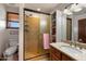 Bathroom featuring a shower with built-in shelves, a sink, toilet, and a modern design for relaxation at 3160 E Fox St, Mesa, AZ 85213