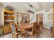 Dining room featuring a large table, chairs, and natural lighting at 3160 E Fox St, Mesa, AZ 85213