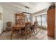 Elegant dining room with a large table, chairs, and natural lighting at 3160 E Fox St, Mesa, AZ 85213