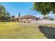 Charming single-story home with a well-manicured lawn and a classic white picket fence at 3160 E Fox St, Mesa, AZ 85213