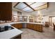 Well-lit kitchen showcasing oak cabinets, sleek countertops, and modern stainless steel appliances at 3160 E Fox St, Mesa, AZ 85213