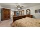 Comfortable bedroom featuring a queen sized bed and antique furnishings, providing a relaxing retreat at 3160 E Fox St, Mesa, AZ 85213