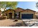 Charming single-story home featuring a well-maintained landscape and a two-car garage at 3233 N 137Th Dr, Avondale, AZ 85392