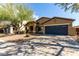 Charming single-story home featuring a well-maintained landscape and a two-car garage at 3233 N 137Th Dr, Avondale, AZ 85392