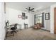 Inviting home office with a ceiling fan, desk, and comfortable seating, perfect for a productive work-from-home environment at 3233 N 137Th Dr, Avondale, AZ 85392