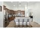 Well-lit kitchen with stainless steel appliances, a center island, and stylish pendant lights at 3233 N 137Th Dr, Avondale, AZ 85392