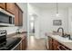 Detailed shot of a kitchen featuring ample cabinetry, stainless steel appliances, and a sink at 3233 N 137Th Dr, Avondale, AZ 85392