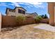 Spacious backyard with brick perimeter wall, mature trees, and a small brick patio at 3235 E Virgil Dr, Gilbert, AZ 85298