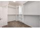 Walk-in closet features carpeted flooring, shelves, and ample storage space at 3235 E Virgil Dr, Gilbert, AZ 85298