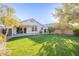 Lush backyard featuring a well-manicured lawn and mature landscaping at 3522 E Edna Ave, Phoenix, AZ 85032