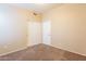 Bedroom featuring neutral walls and carpet, with a closet for ample storage space at 3522 E Edna Ave, Phoenix, AZ 85032