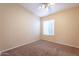 Bedroom with carpeted floor, ceiling fan, and window providing natural light at 3522 E Edna Ave, Phoenix, AZ 85032