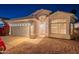 Inviting single-story home exterior with a well-manicured front yard and covered entryway at twilight at 3522 E Edna Ave, Phoenix, AZ 85032