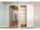 Hallway featuring a closet with shelving at 3522 E Edna Ave, Phoenix, AZ 85032