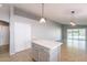 Bright kitchen featuring a kitchen island with white countertop and stainless steel appliances at 3522 E Edna Ave, Phoenix, AZ 85032