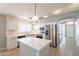 Modern kitchen with white cabinets, stainless steel appliances, and a large island at 3522 E Edna Ave, Phoenix, AZ 85032