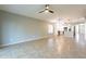 Spacious living room with tile flooring that connects to a kitchen with stainless steel appliances at 3522 E Edna Ave, Phoenix, AZ 85032