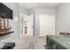 Relaxing bedroom featuring carpet floors and a peek into the ensuite bath at 35306 N 31St Dr, Phoenix, AZ 85086