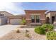 Charming single-story home with stone accents and a well-maintained desert-landscaped front yard at 35306 N 31St Dr, Phoenix, AZ 85086