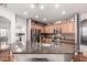 Modern kitchen featuring granite countertops, stainless steel appliances and ample lighting at 35306 N 31St Dr, Phoenix, AZ 85086