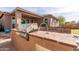 Outdoor kitchen with a built-in grill, perfect for entertaining at 35306 N 31St Dr, Phoenix, AZ 85086