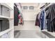 Organized walk-in closet with shelves and hanging space at 35306 N 31St Dr, Phoenix, AZ 85086