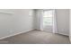 Bedroom with carpet flooring, natural light, and two windows with curtains and blinds at 3532 E Alfalfa Dr, Gilbert, AZ 85298