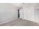 Bedroom featuring neutral carpet flooring, and white sliding door closet at 3532 E Alfalfa Dr, Gilbert, AZ 85298