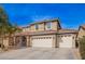 Beautiful two-story home featuring a three-car garage, tiled roof, and neutral color scheme at 3532 E Alfalfa Dr, Gilbert, AZ 85298