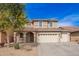 Inviting two-story home with three-car garage, covered entry, and well-maintained landscaping at 3532 E Alfalfa Dr, Gilbert, AZ 85298