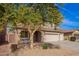 Charming two-story home with a large tree in the front yard and three-car garage at 3532 E Alfalfa Dr, Gilbert, AZ 85298