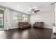 Spacious living room features sleek wood floors, ceiling fan, and plenty of natural light at 3532 E Alfalfa Dr, Gilbert, AZ 85298