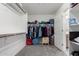 Walk-in closet is carpeted and features shelves, hanging rods and a small dresser at 3532 E Alfalfa Dr, Gilbert, AZ 85298