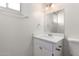 Well-lit bathroom vanity with modern sink, lighting, and ample storage at 3635 W Cortez St, Phoenix, AZ 85029