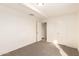 Bedroom with neutral carpet, white walls, and a double door closet at 3635 W Cortez St, Phoenix, AZ 85029