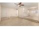 Bright living room with tile flooring, ceiling fan, and an open layout to the kitchen at 3635 W Cortez St, Phoenix, AZ 85029