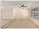 Open living room features tile floors, ceiling fan, and natural light at 3635 W Cortez St, Phoenix, AZ 85029