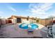 Fenced swimming pool in backyard with diving board and pool equipment at 3635 W Cortez St, Phoenix, AZ 85029