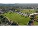 Aerial view of a park featuring sports fields, walking paths, and green spaces in a Gathering-friendly community at 37808 N Pagoda Ln, Phoenix, AZ 85086