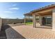 Backyard featuring a covered patio and brick pavers at 37808 N Pagoda Ln, Phoenix, AZ 85086