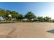 Community basketball court offers a space for sports and recreation in a green, tree-lined setting at 37808 N Pagoda Ln, Phoenix, AZ 85086