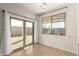 A brightly lit dining area with a sliding glass door and a window at 37808 N Pagoda Ln, Phoenix, AZ 85086