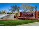 Beautiful brick entrance sign to the Anthem community with green grass and attractive desert landscaping at 37808 N Pagoda Ln, Phoenix, AZ 85086