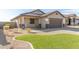 Attractive single-story home featuring desert landscaping, a tile roof, and a two-car garage at 37808 N Pagoda Ln, Phoenix, AZ 85086