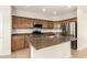 A kitchen showing stainless steel appliances, an island, and wood cabinetry at 37808 N Pagoda Ln, Phoenix, AZ 85086