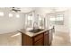 A kitchen island features a stainless steel sink and dishwasher at 37808 N Pagoda Ln, Phoenix, AZ 85086