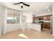 Bright kitchen featuring tile floors, wooden cabinets, stainless steel appliances, and a center island at 37808 N Pagoda Ln, Phoenix, AZ 85086